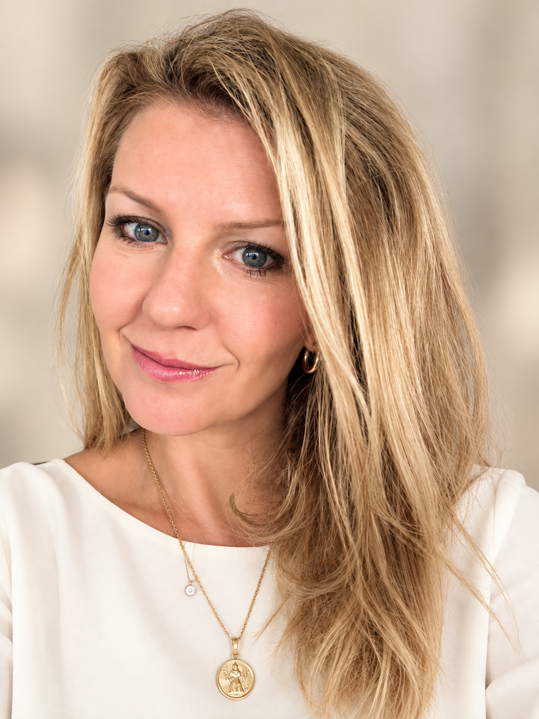 Manuela Santambrogio in an ivory blouse