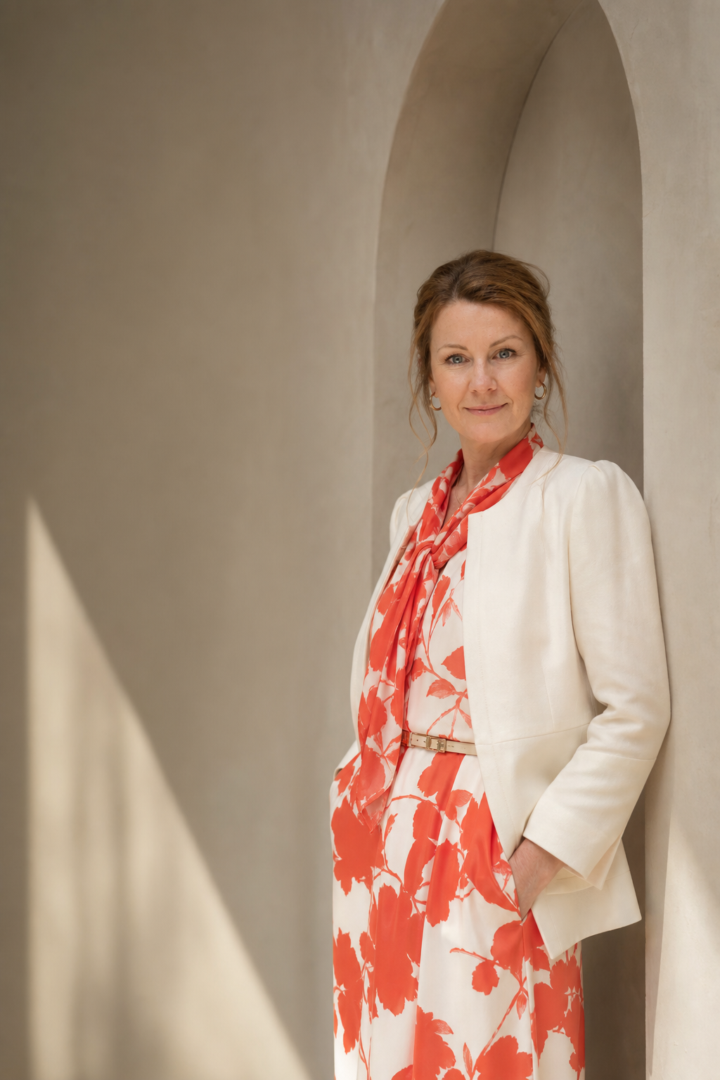 Manuela Santambrogio in a white jacket and red-and-white outfit